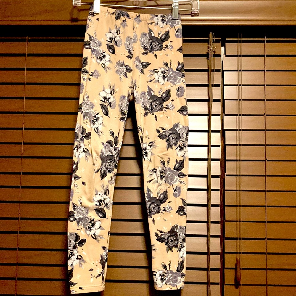 Justice peach leggings with grey roses.